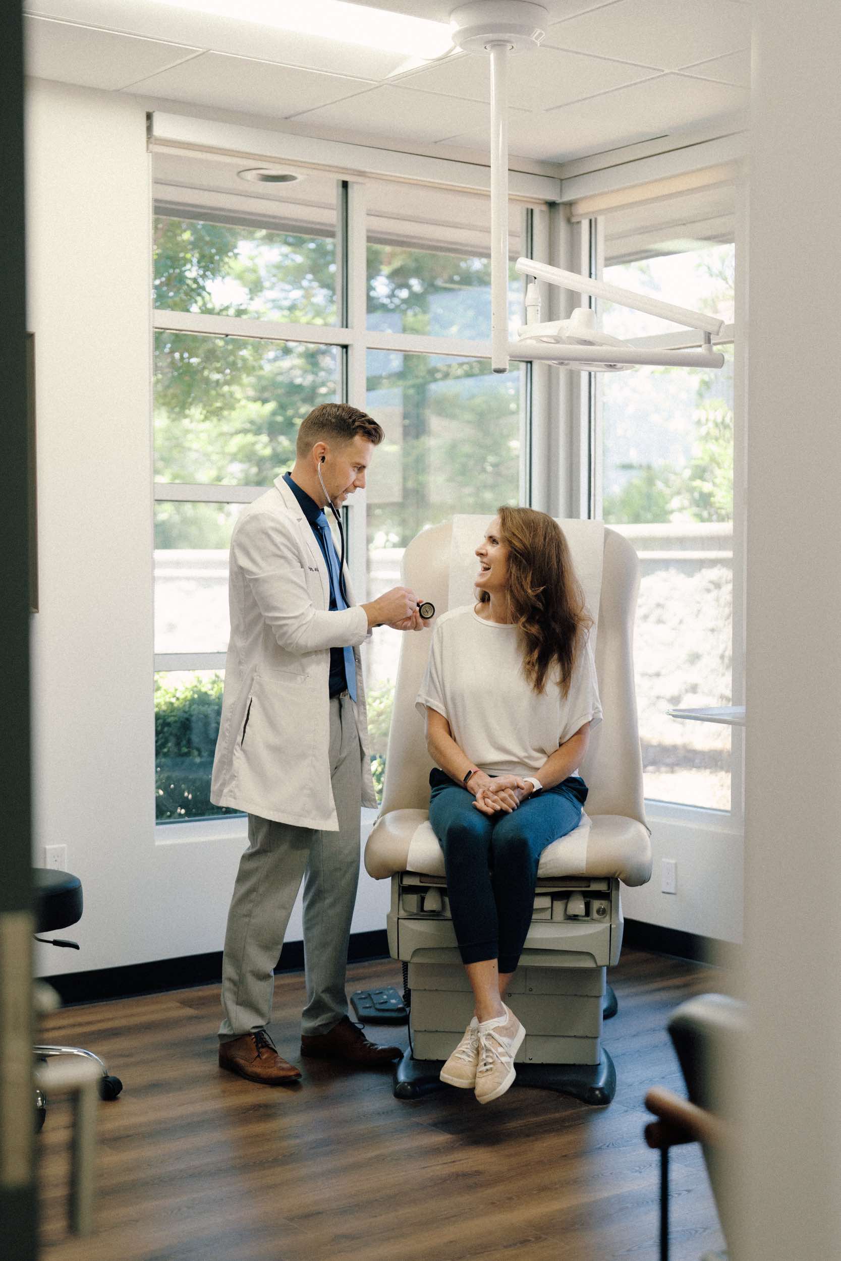 Physician providing an in-office exam